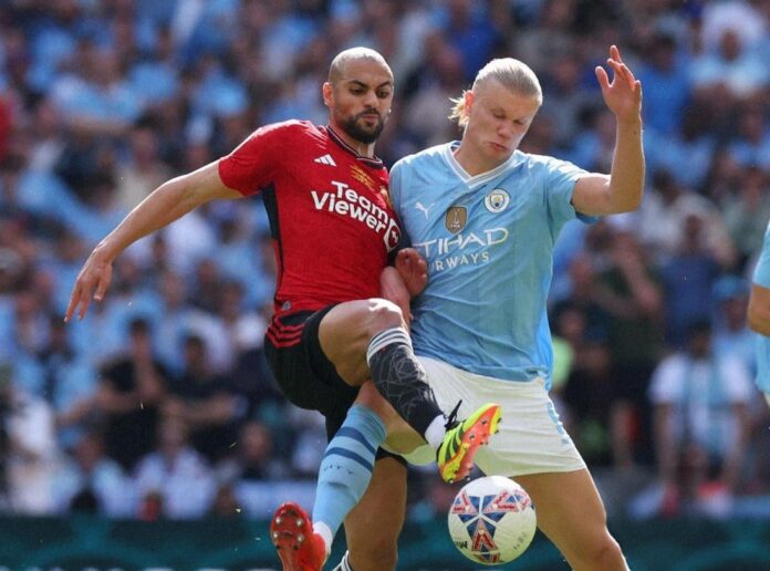 Sofyan Amrabat og Erling Braut Haaland